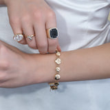 Gold abortion pill bracelet