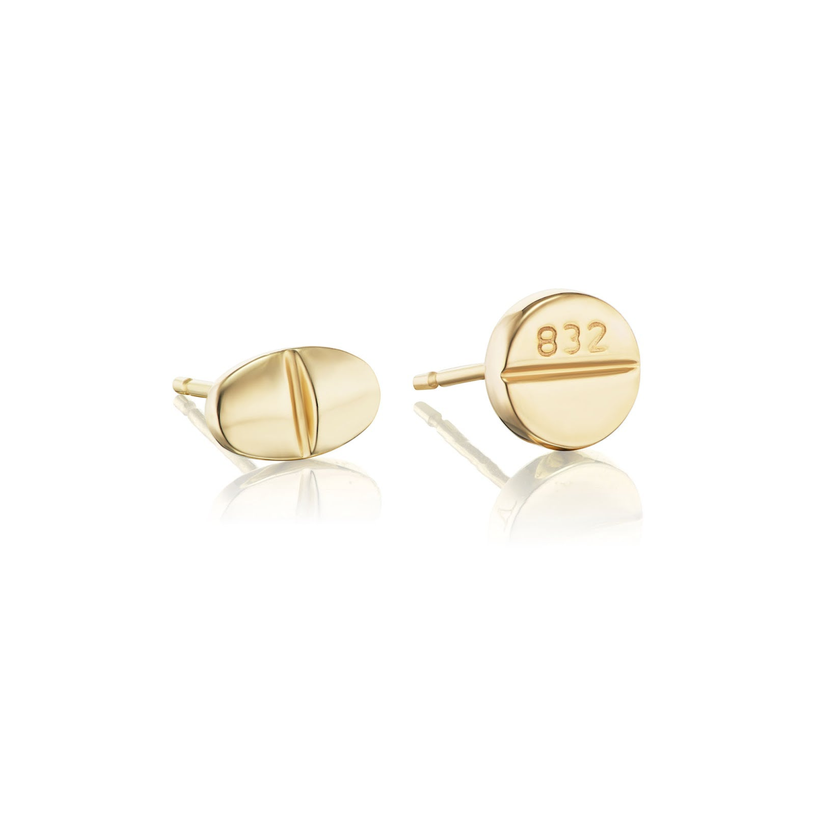 Mad Fine mismatched pair of solid 14k gold stud earrings, one oval and one round, inspired by prescription pills.
